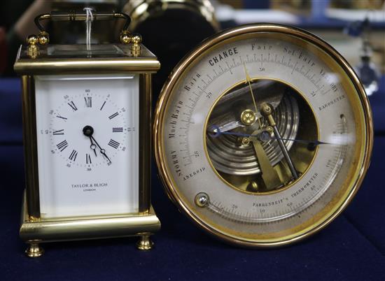 A French eight day carriage timepiece, retailed by Taylor & Bligh, and a brass framed aneroid barometer